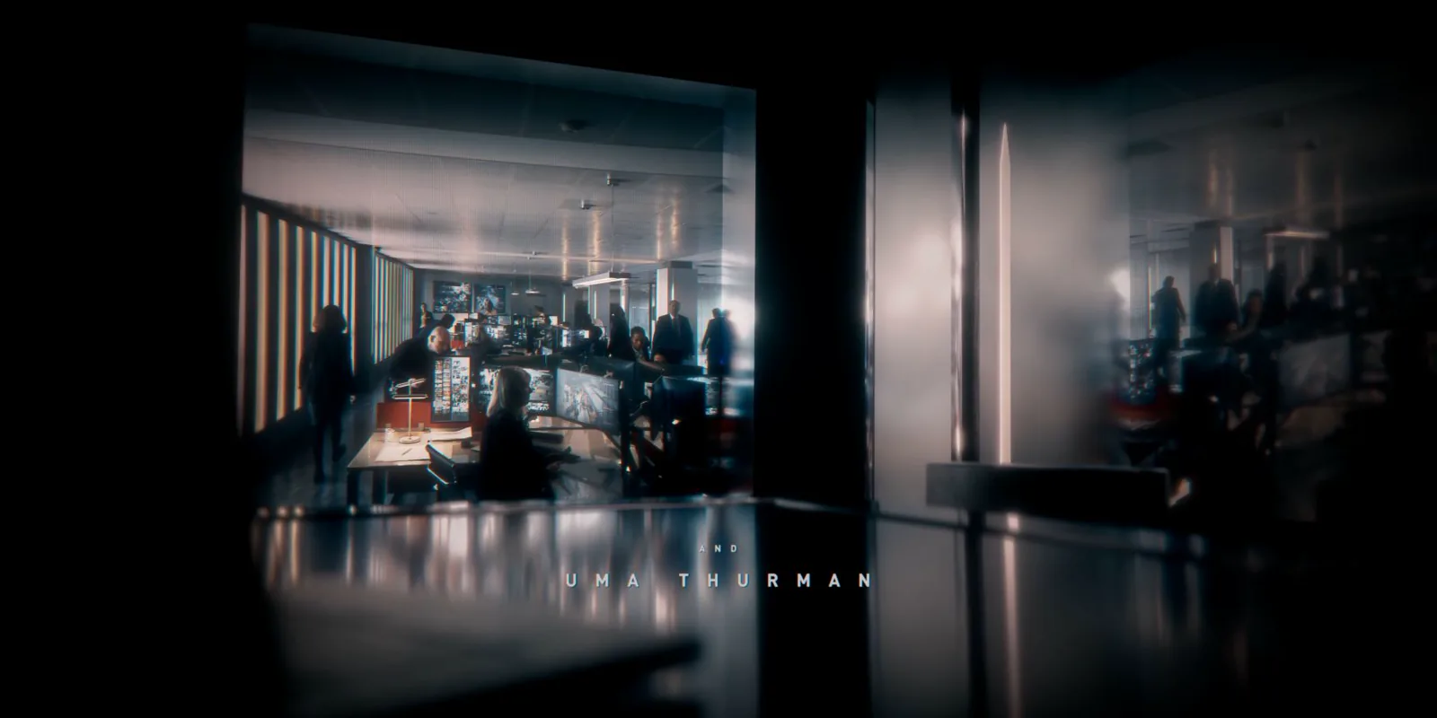 A meeting room fragmented by dark reflective panels